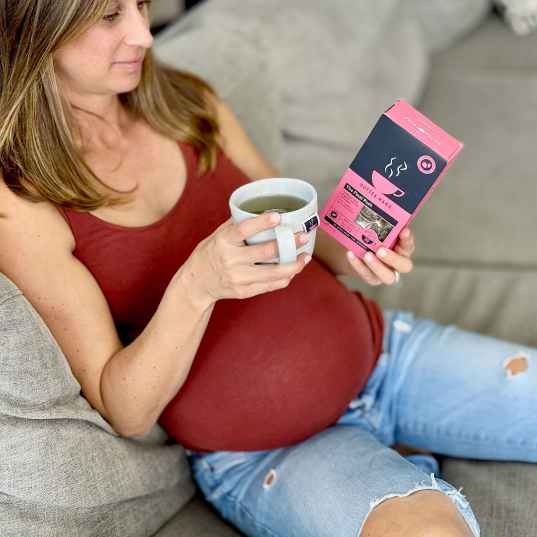 Image of a pregnant women drinking a cup of the Final Push Raspberry Leaf Tea reading the brewing instructions