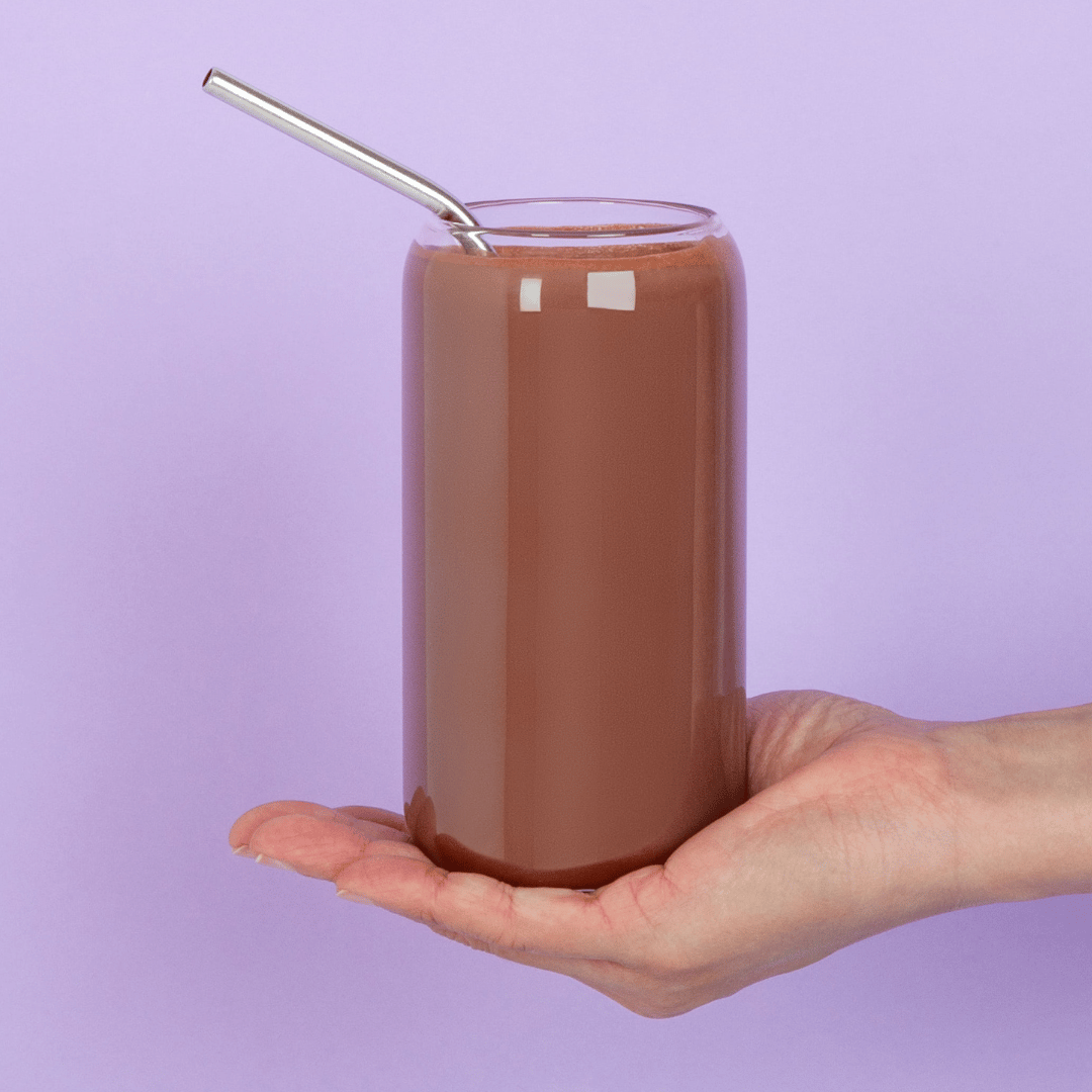 iamge of a hand holding a glass of iced hot chocolate