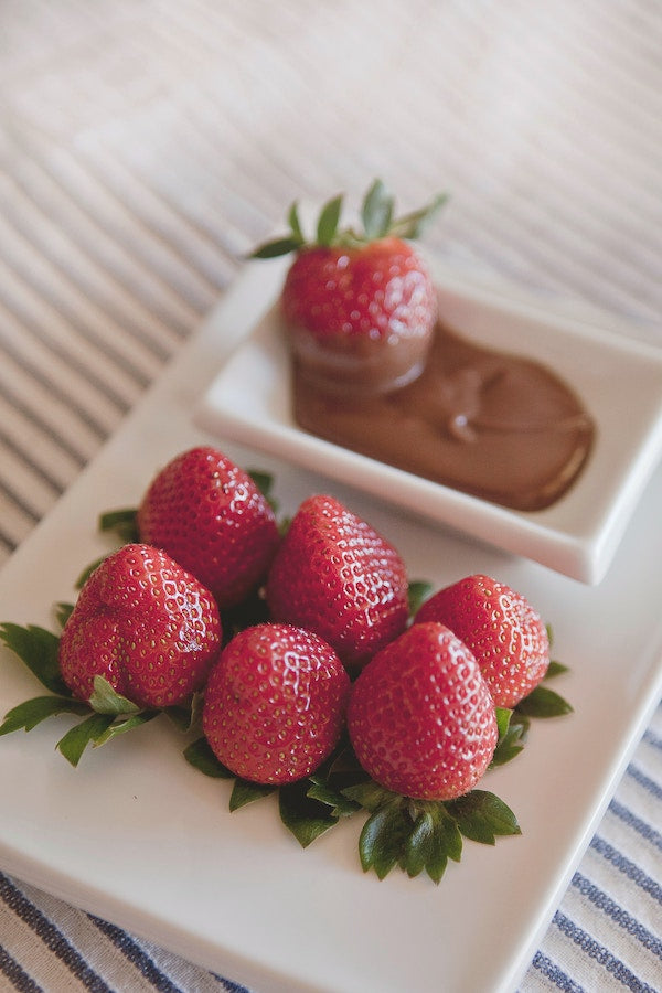 Strawberries and chocolate sauce on a plate