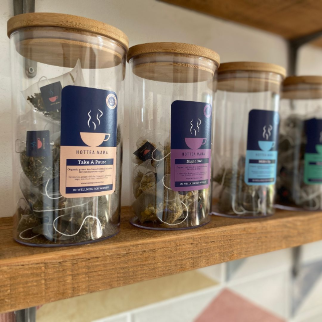 HotTea Mama tea storage jars on kitchen shelves