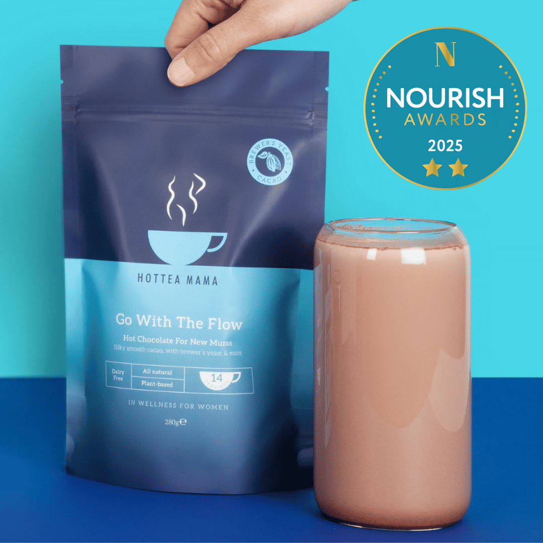 HOTTEA MAMA hot chocolate packaging with a glass of hot chocolate on a blue background, featuring the Nourish Awards 2025 logo.