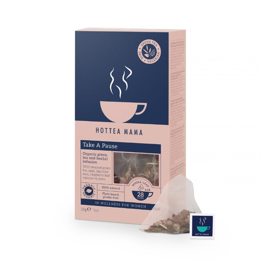 HotTea Mama Organic Take A Pause menopause tea pack, next to whole leaf tea bag containing green tea, raspberry leaf, sage, liquorice root, ginseng and valerian root
