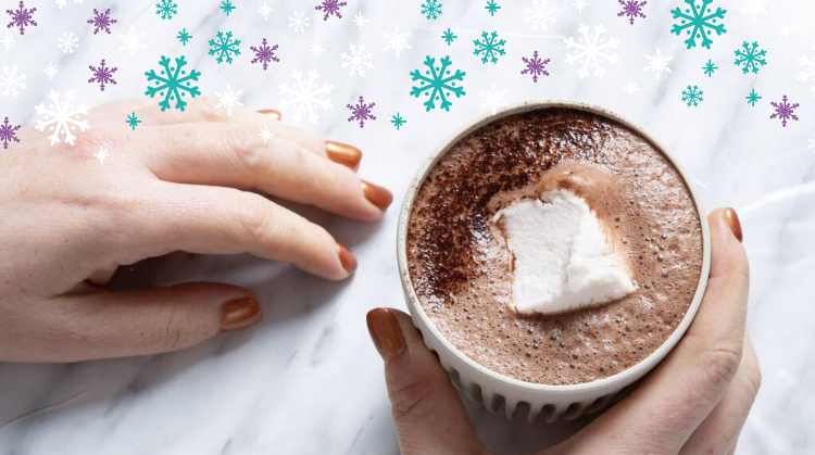 HotTea Mama hot chocolate with marshmallow in womens hands