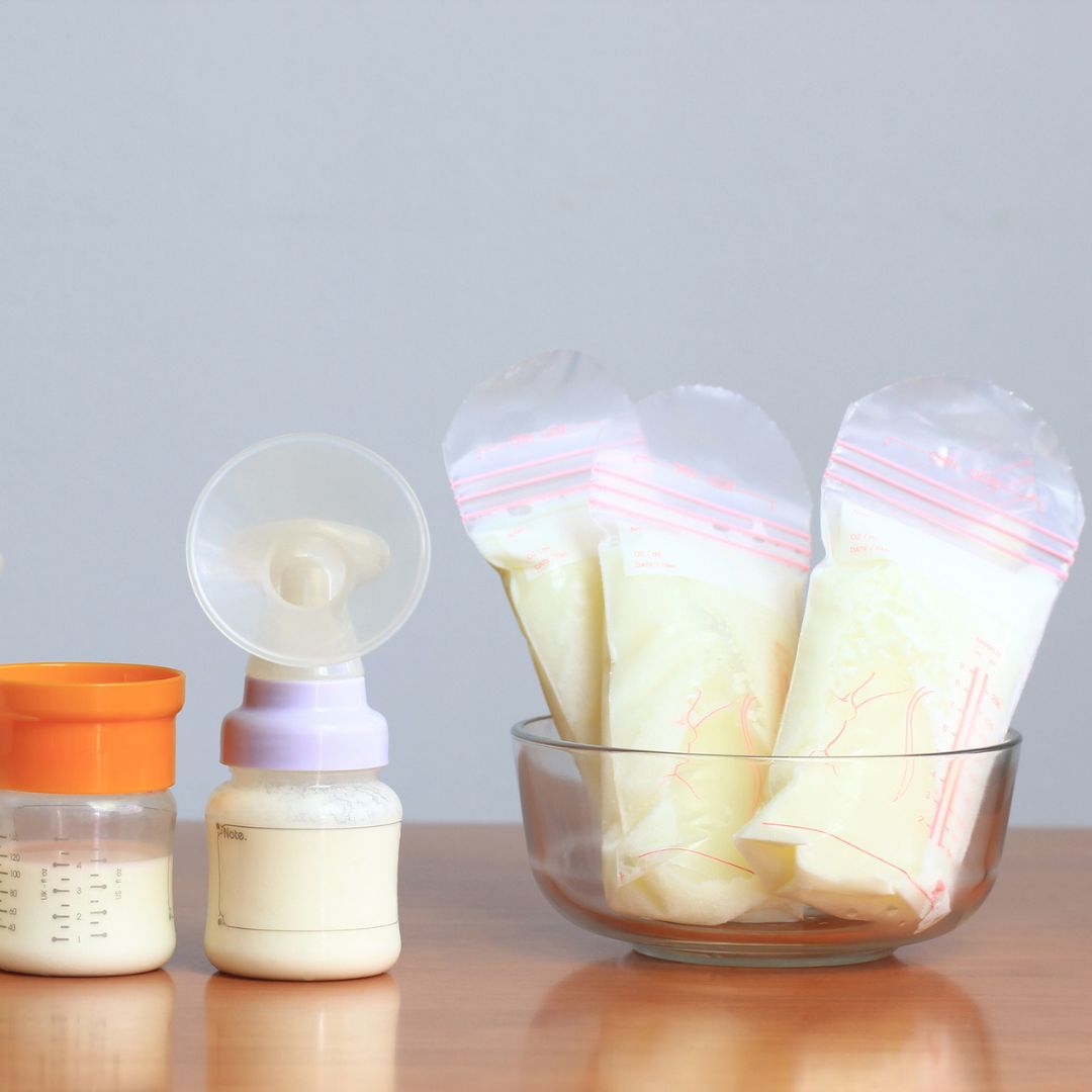 Breast pump and storage bags, full of breast milk 