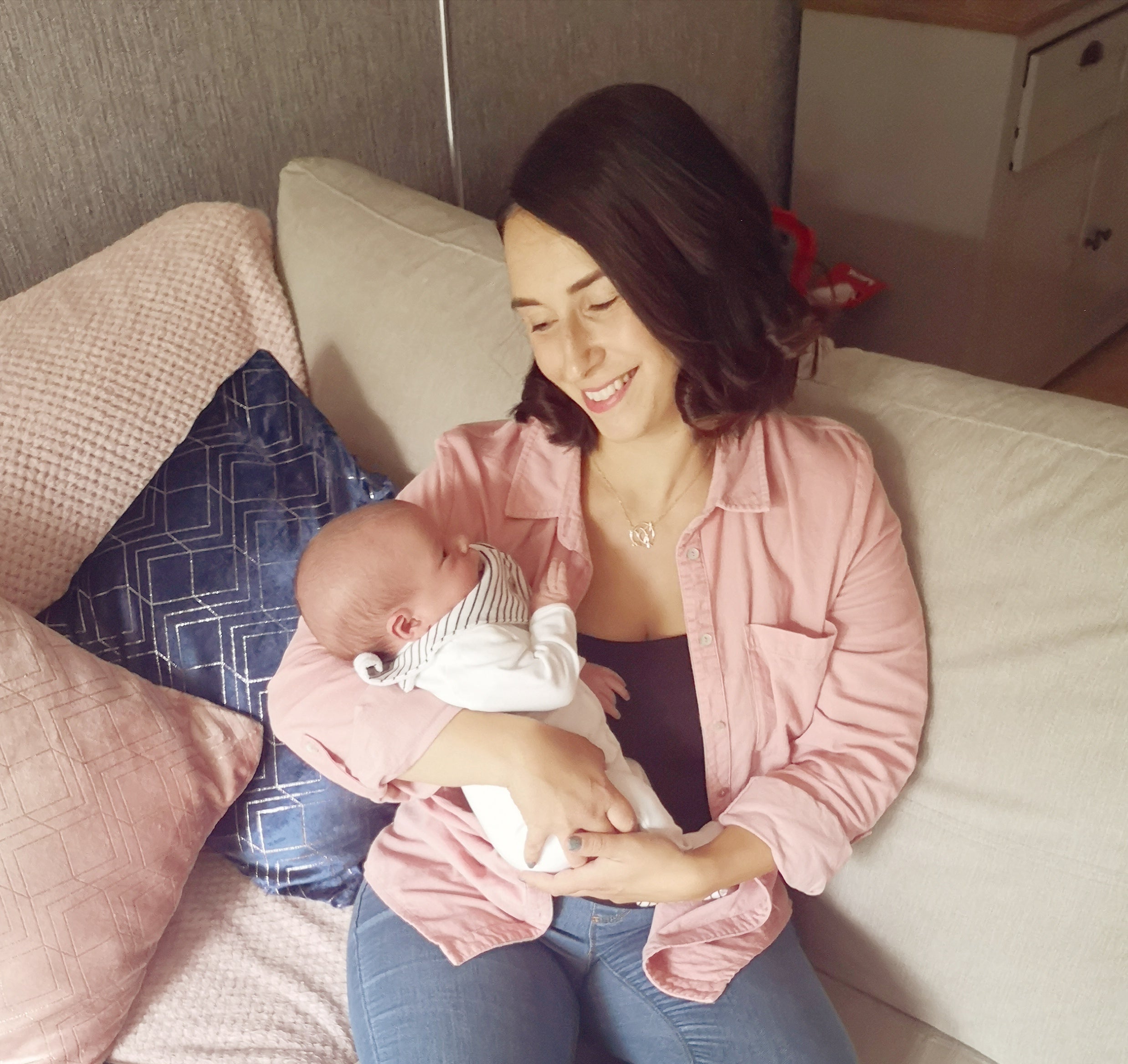 Mum on sofa, holding baby