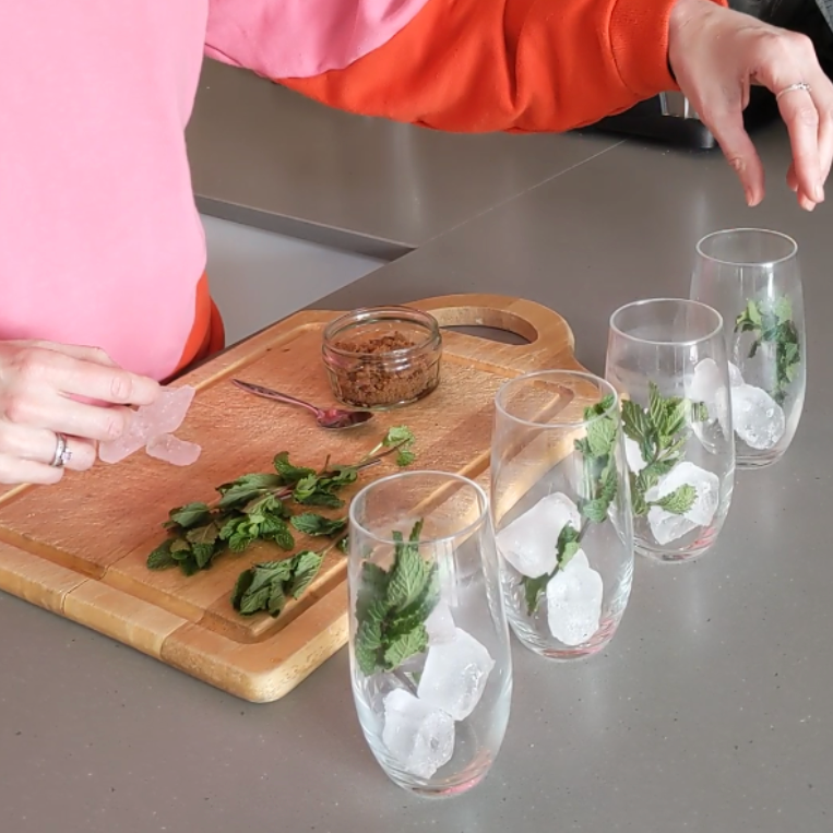 Close up of glasses with ice and mint in ready to make tea mojitos