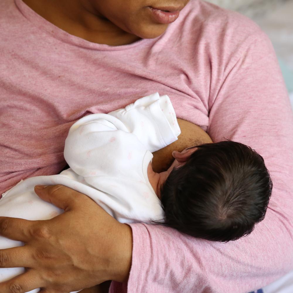 Baby being breastfed by her mum