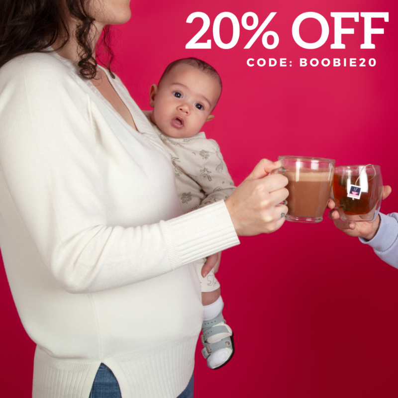 Woman holding a baby and a mug of breastfeeding hot chocolate and a glass of lactation tea, with a HotTea Mama promotional offer on a red background