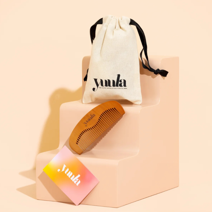 Yuula Labour Comb and pouch on step plinth