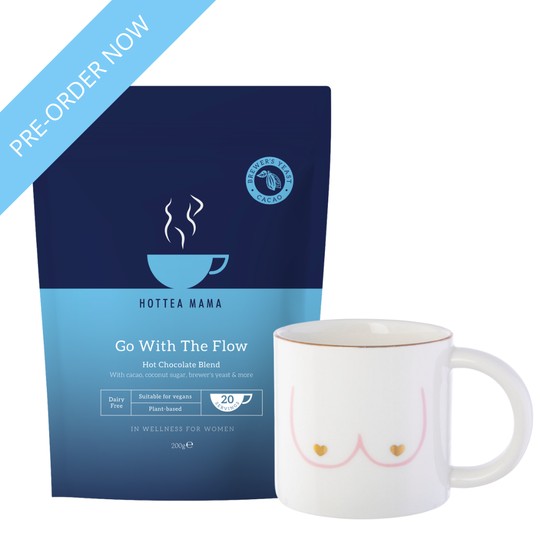 HotTea Mama Go With The Flow Breastfeeding hot chocolate blend package with a white mug featuring a hand painted boobies design.